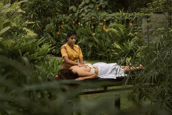 Ayurvedic massage in the open-air garden pavilion