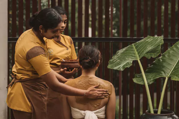 Therapists preparing a personalised Ayurvedic treatment